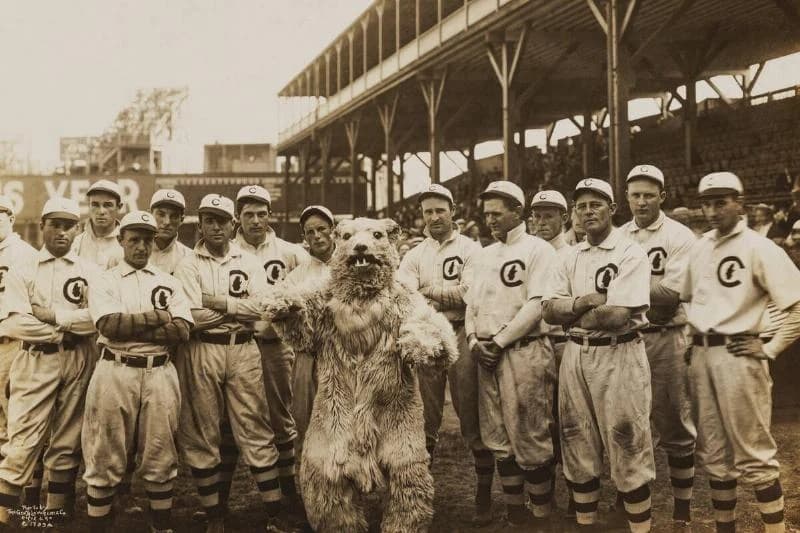 Portrait of the Chicago Cubs baseball team, with the team's mascot, as they pose on the field at West Side Grounds, Chicago, Illinois, 1908.