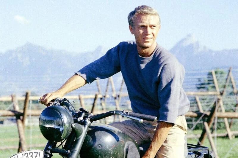 Steve McQueen sitting on Motorcycle as Hilts in The Great Escape