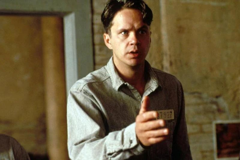 Tim Robbins extending hand as Andy Dufresne in The Shawshank Redemption