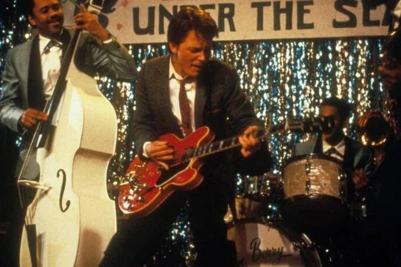 Michael J. Fox playing guitar as Marty McFly in Back To The Future