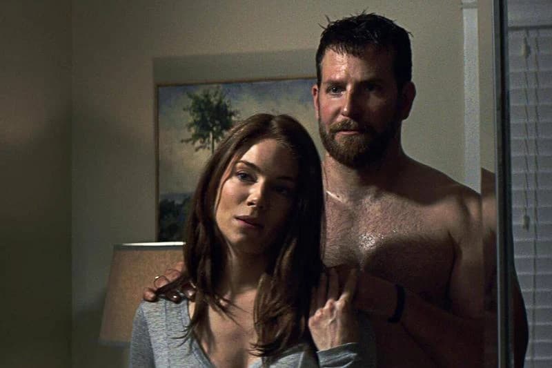 Bradley Cooper and Sienna Miller as Chris Kyle and Taya Renae Kyle in American Sniper